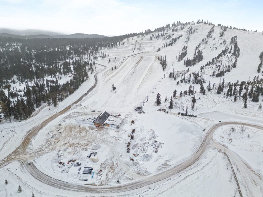Deer Mountain Village subdivision in the Black Hills with custom homes under construction by Legacy Custom Homes & Design in winter.
